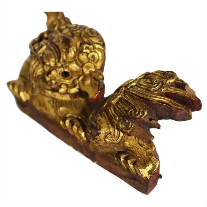 Gold-painted wood antique Chinese temple carvings pair with intricate dragon designs and detailed rectangular bases, close-up.