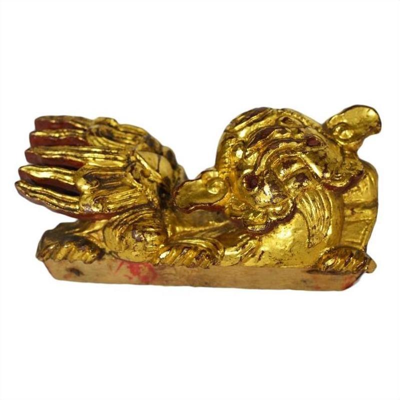 Gold antique Chinese temple dragon carvings pair, gold material, reclining on white background, close-up.