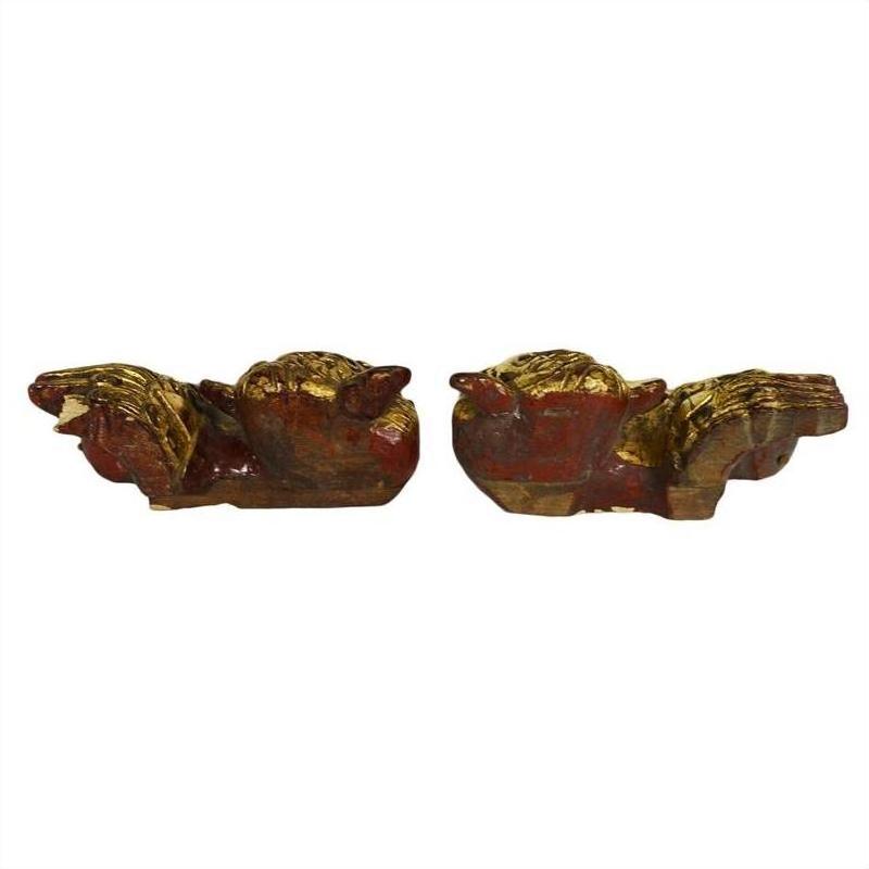 Gold and red antique Chinese dragon-shaped temple carvings displayed on a white background.