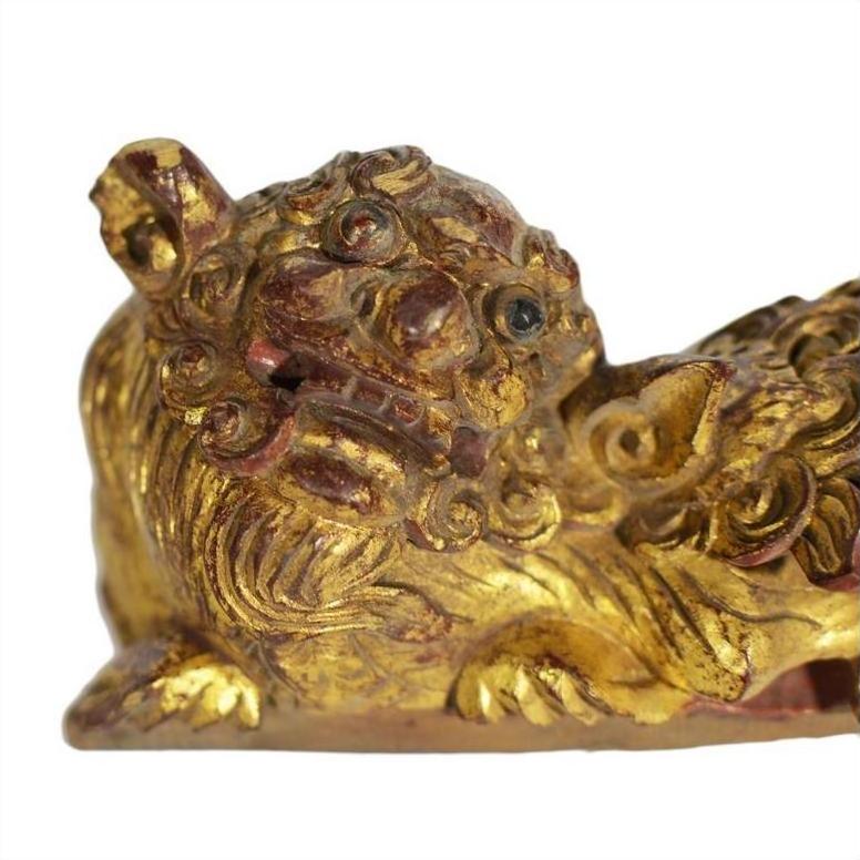 Close-up of gold and red antique Chinese temple dragon carvings, pair, showing intricate details.
