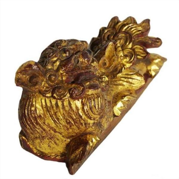 Ornate dragon-shaped antique Chinese temple carvings, wood, both facing upward, close-up pair view.