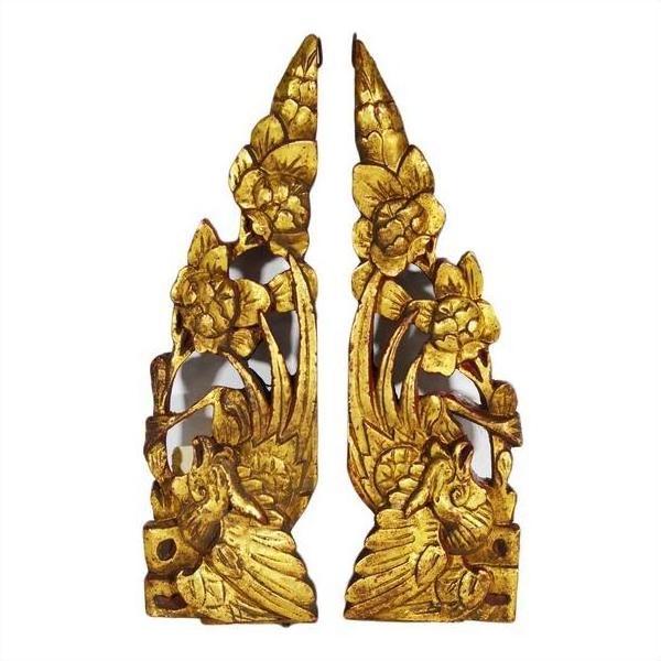 Close-up of white antique Chinese temple carvings with gold floral and bird motifs, framed by silver borders.