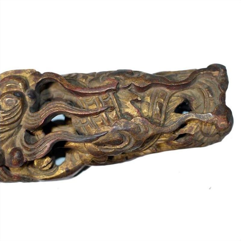 Close-up of antique wood Chinese temple carvings pair with intricate carved dragon motif.