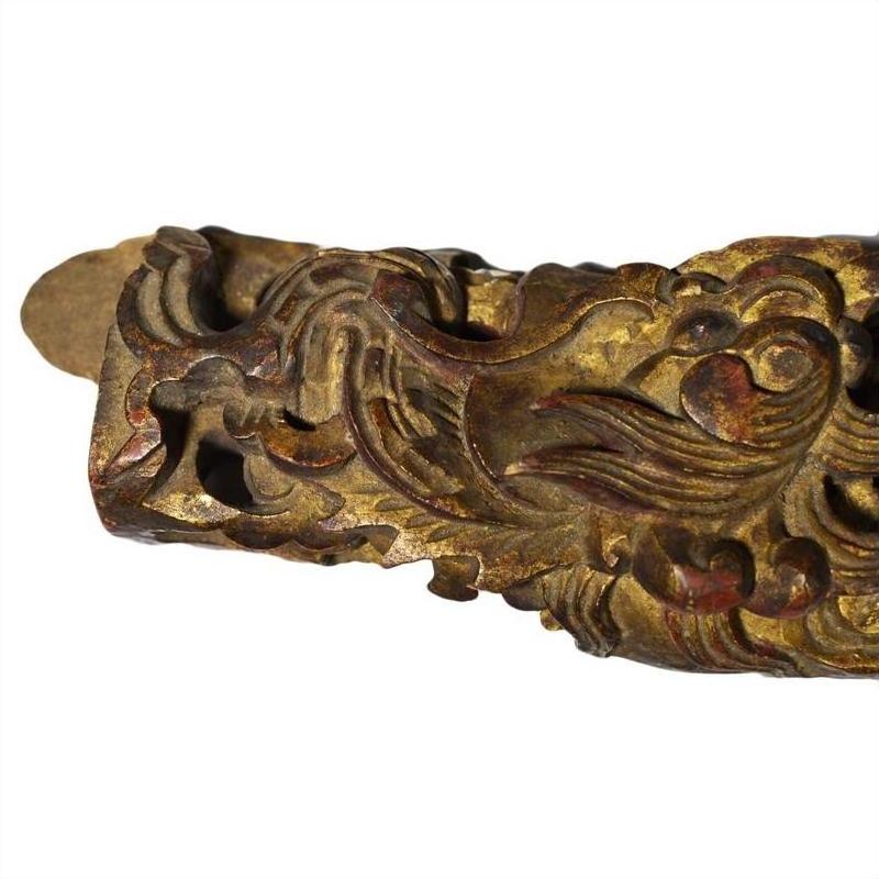Gold gilded wood antique Chinese temple carvings pair, intricate swirl details, white background, close-up view.