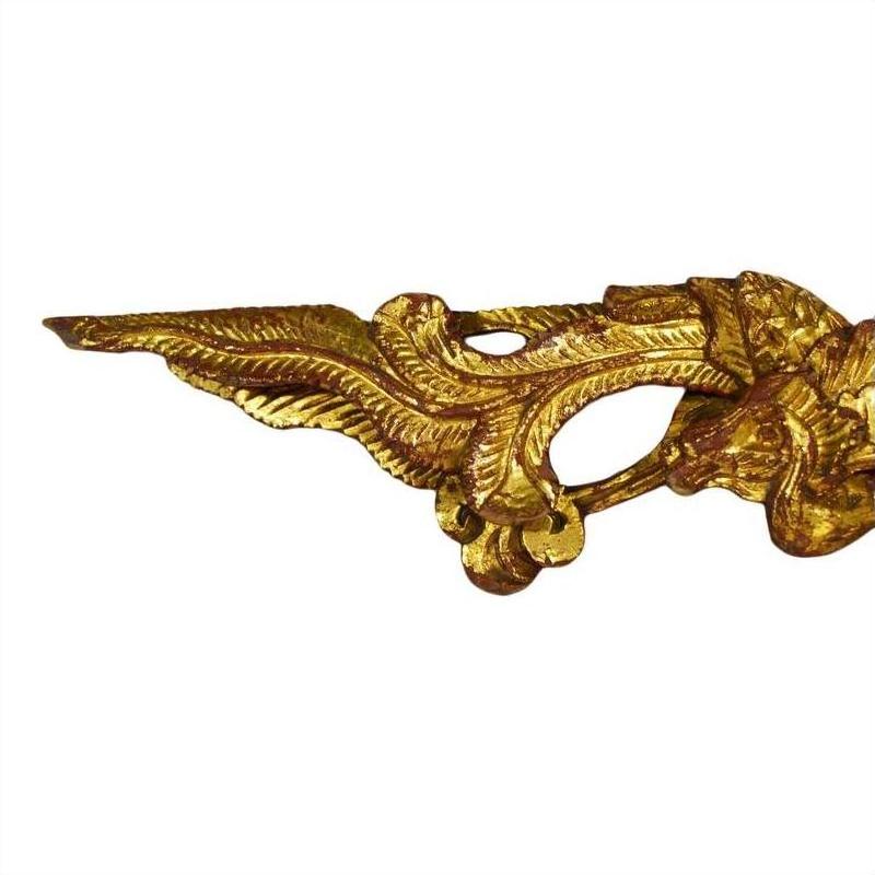 Pair of gold and red antique Chinese temple carvings, intricate detailing on white background, close-up view.