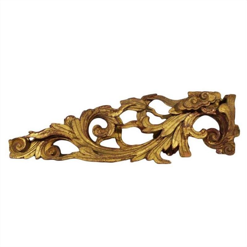 Gold wood antique Chinese temple carvings with ornate floral and leaf patterns, side view on white background.