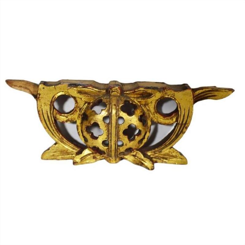 Gold-toned metal Chinese temple carvings pair with circular floral cutouts and side wings, close-up.