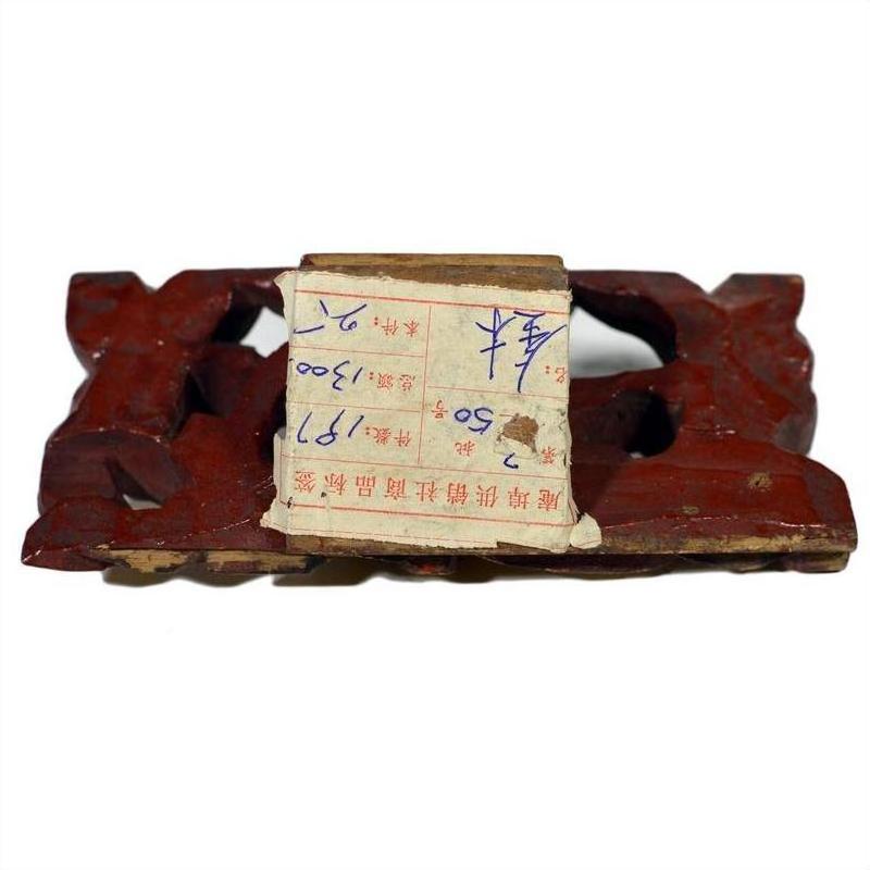 Red wood antique Chinese temple carvings with worn paper label, handwritten numbers, and Chinese text.