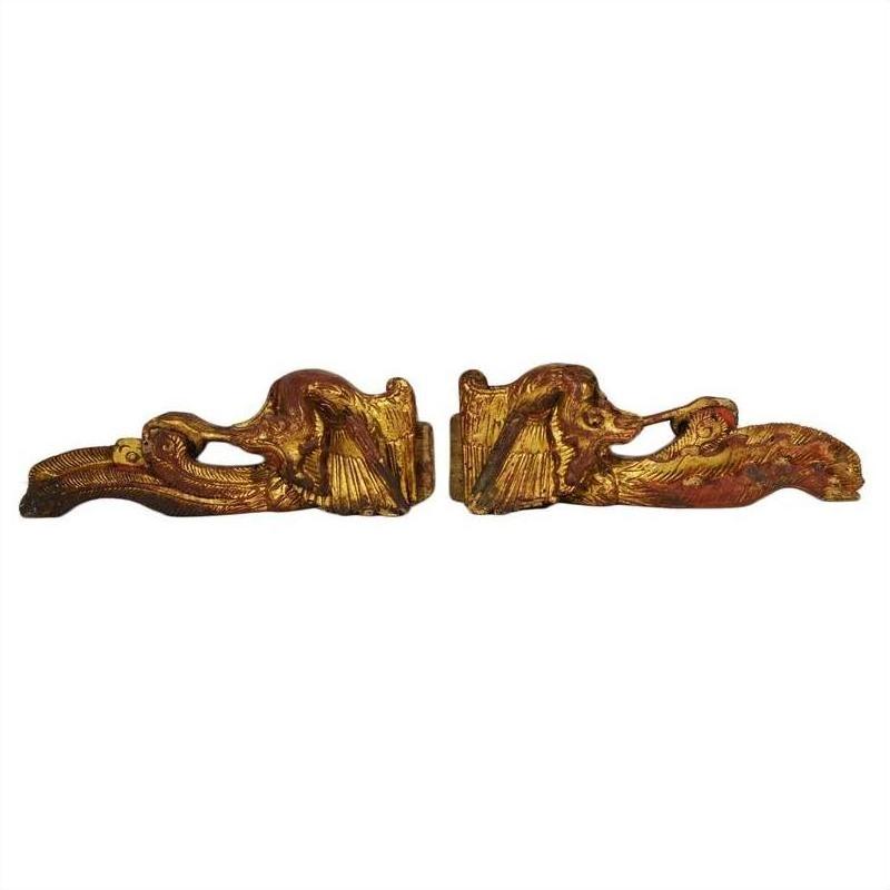 Gold-painted wood antique Chinese temple carvings with carved animal figures on white background.