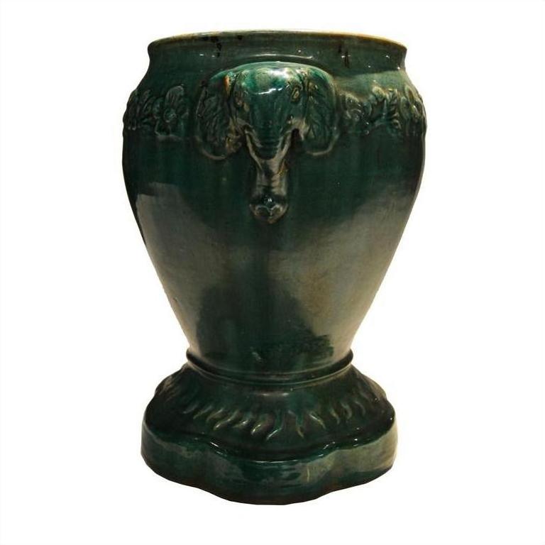 Antique glazed ceramic Annamese garden seat or side table with embossed elephant head and detailed top patterns.