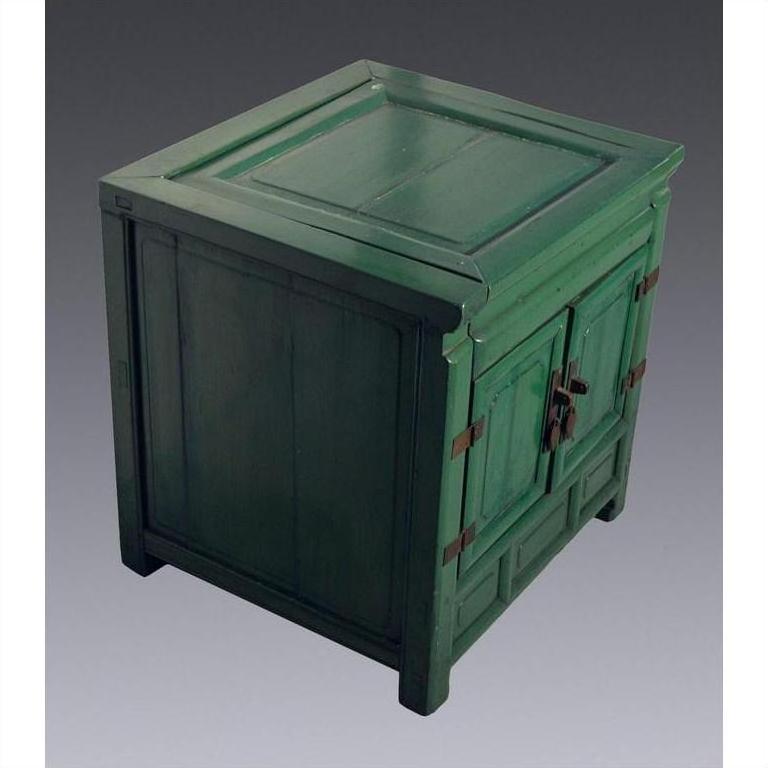 Antique green lacquer cabinet with metal hinges, two front doors, displayed against a gray background.