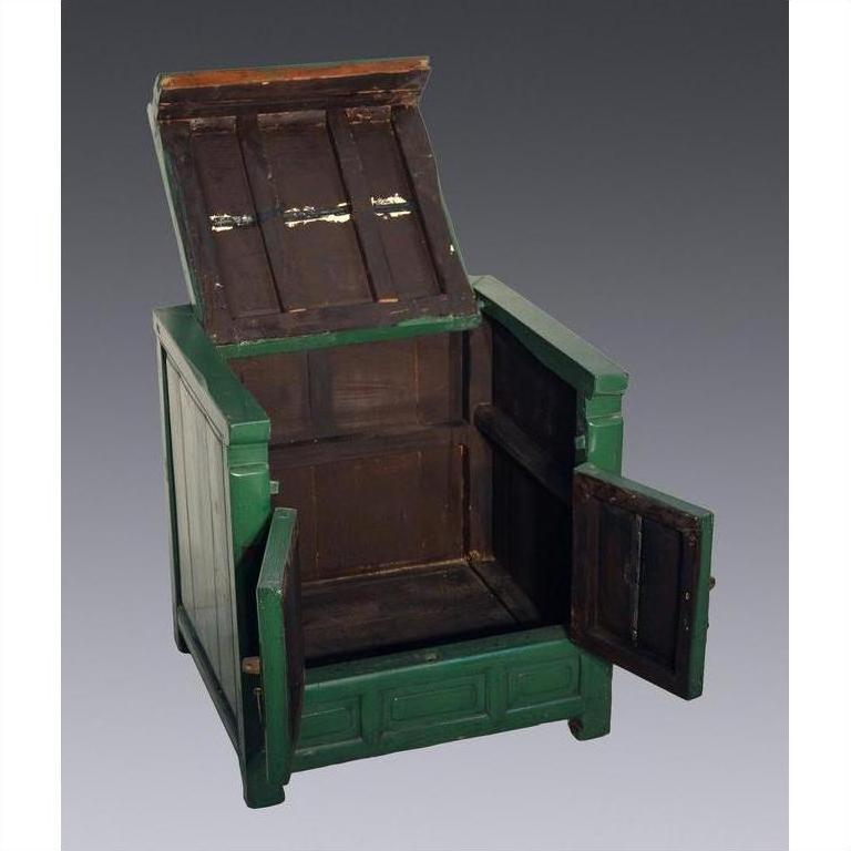 Antique green lacquer cabinet with open seat lid and front doors, showing empty storage space inside.