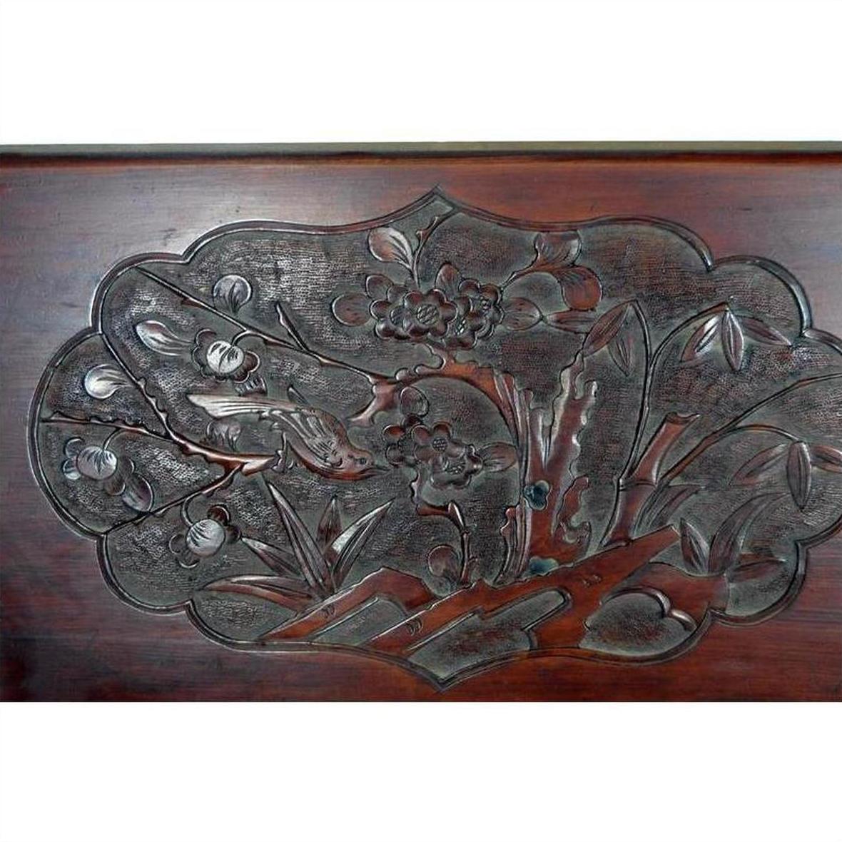 Lacquered rosewood wall plaque with hand-carved tiger and floral details, antique finish, close-up view.