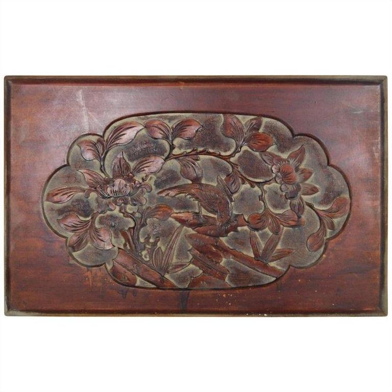 Dark rosewood wall plaque with hand-carved lacquer finish, showing intricate central floral and bird design.