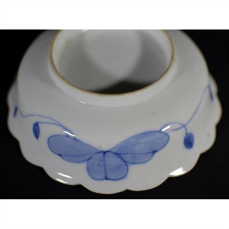 Blue and white porcelain bowls set with butterfly design and scalloped edges, hand-painted, antique Japanese Imari.