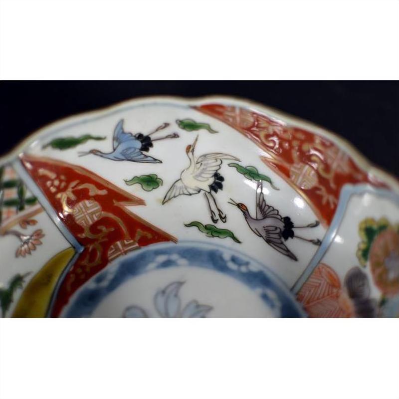 White porcelain Imari bowls with hand painted cranes, green clouds, red and gold geometric rims, set of 4.