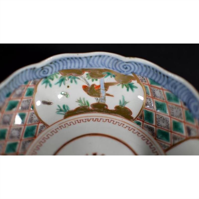 Close-up of a colorful porcelain Japanese Imari bowl with hand-painted floral and geometric patterns.