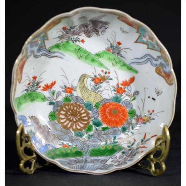 Multicolor porcelain Japanese Imari bowl with hand painted florals and birds on ornate brass stand.