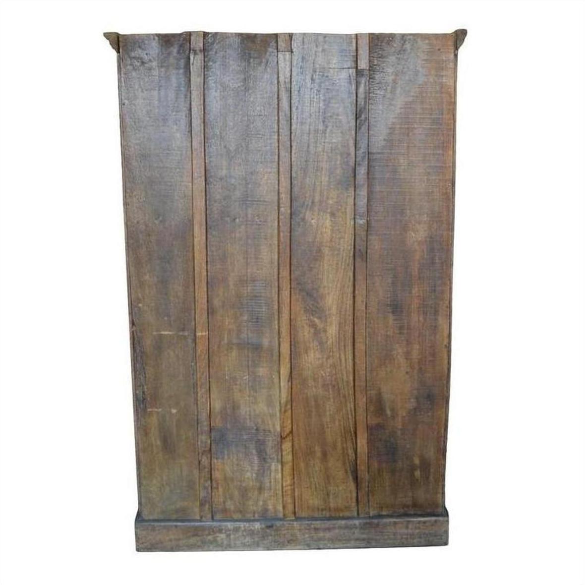Brown wood panel close-up with visible grain, rustic finish, resembling an antique Indian cabinet carved door.
