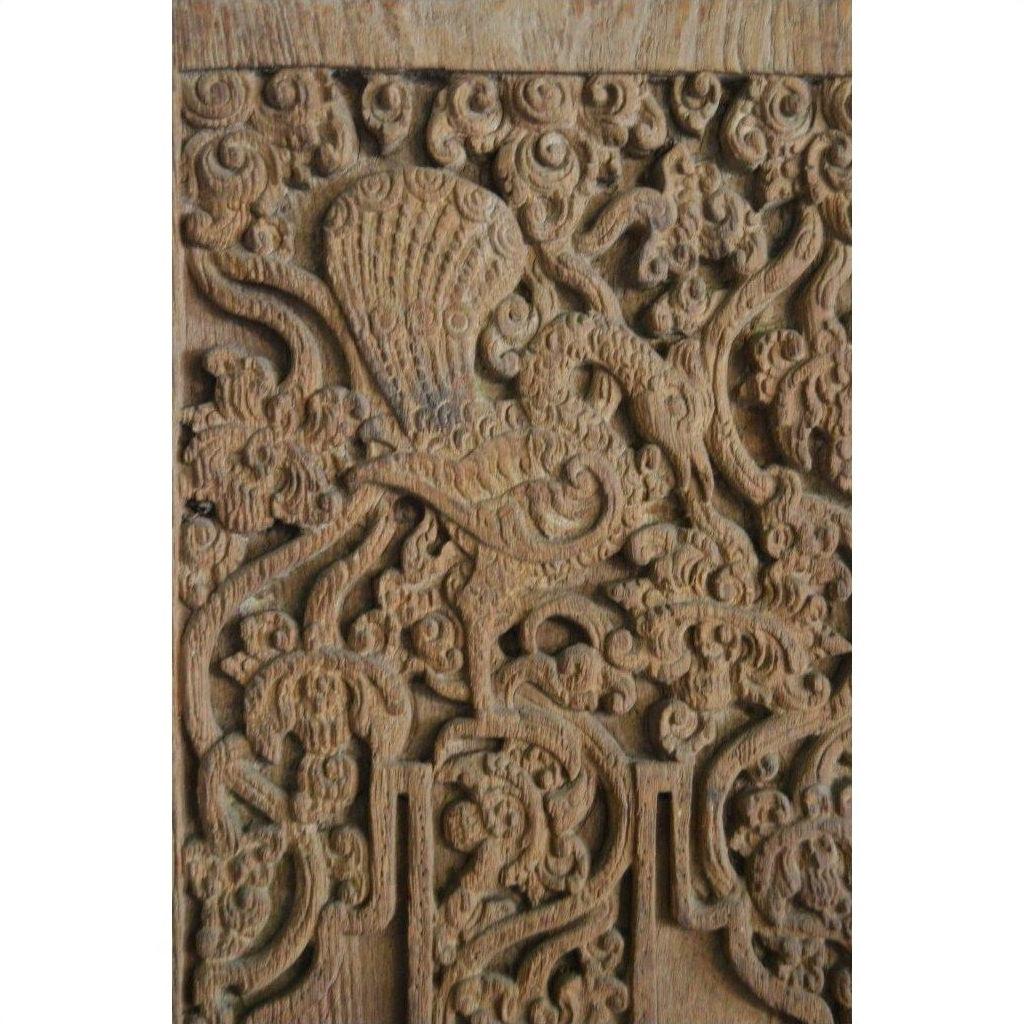 Brown Sheesham wood antique Indian door with intricate floral and mythical creature carvings.