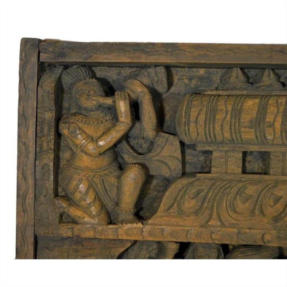 Brown sheesham wood temple plaque, antique, hand-carved with kneeling figure and ornate structure, early 20th century.