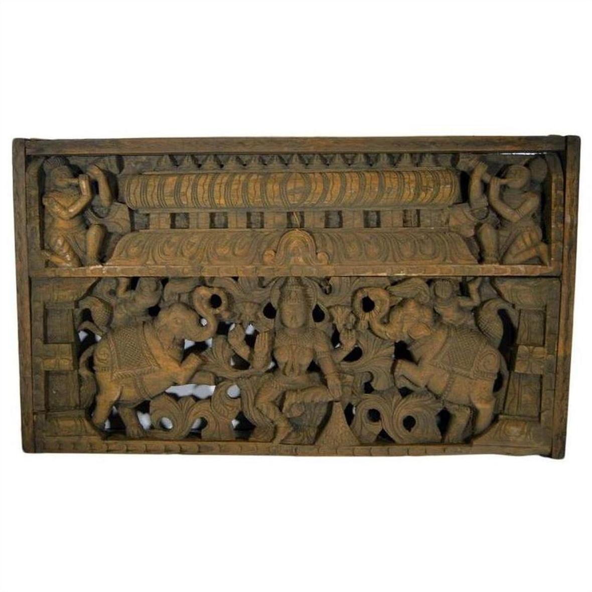 Brown Sheesham wood temple plaque with hand-carved deities and ornate religious figures, early 20th century.