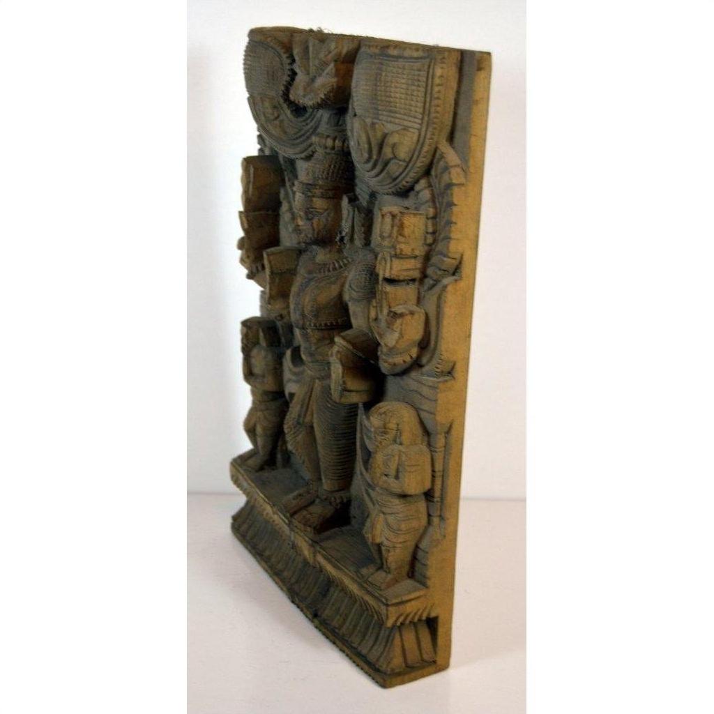 Brown sheesham wood carving with multiple figures in traditional attire, angled view.