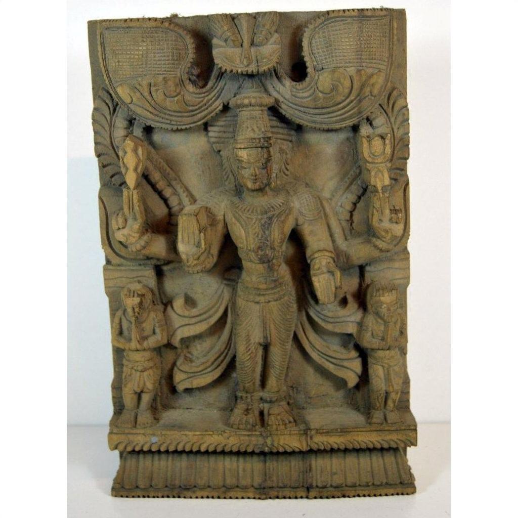 Brown sheesham wood Shiva statue with two smaller figures, Indian antique carving, close-up view.