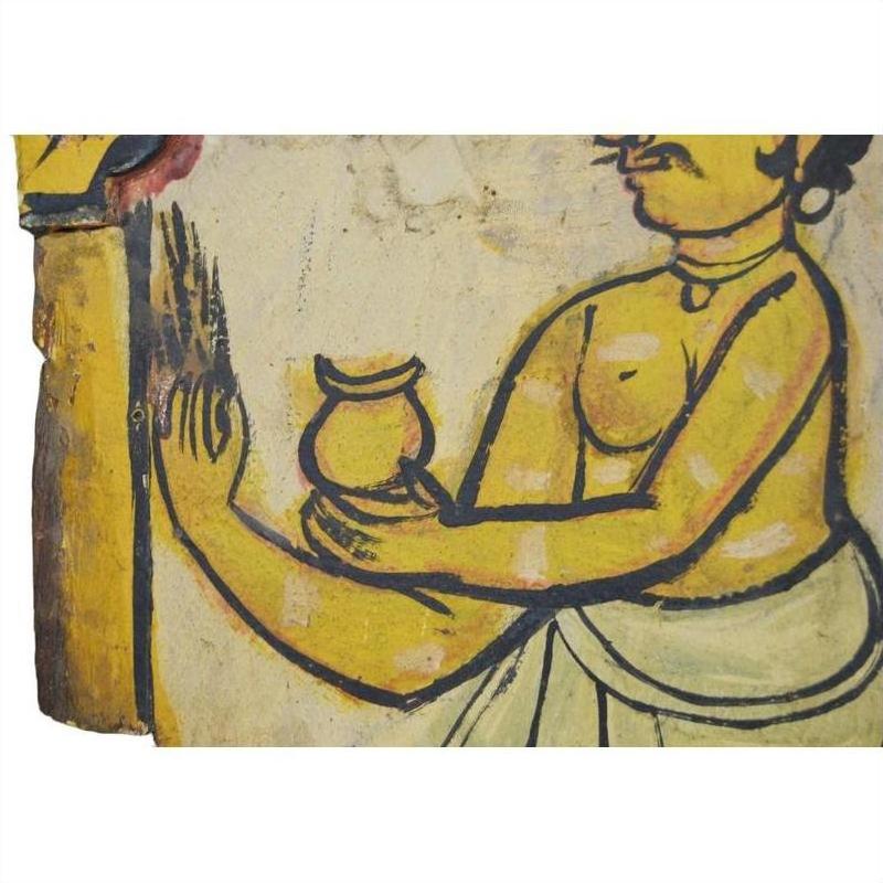 Painted figure holding small pot beside antique Indian wood shrine, New Delhi origin, close-up view.