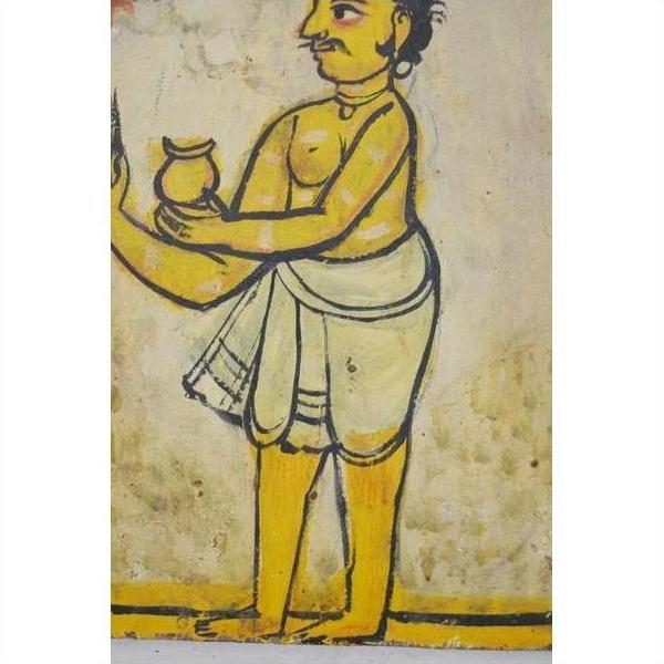 Close-up of antique Indian wood shrine from New Delhi with yellow-skinned figure in white holding small pot.