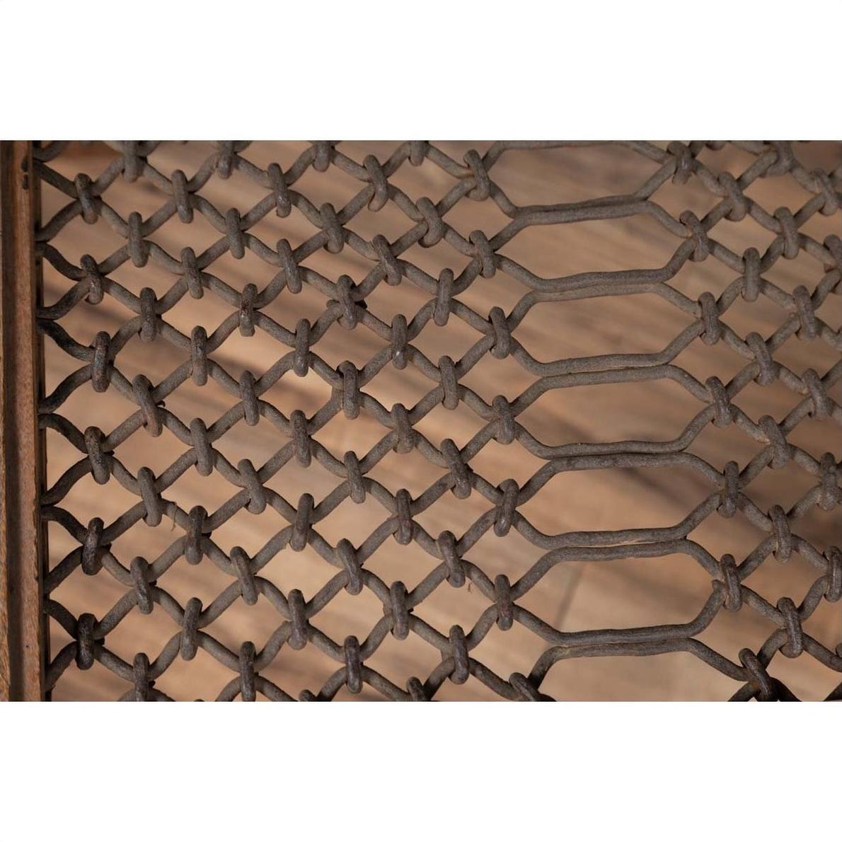 Close-up of brown wood side table with woven rope lattice, window grate design, and carved baluster legs indoors.
