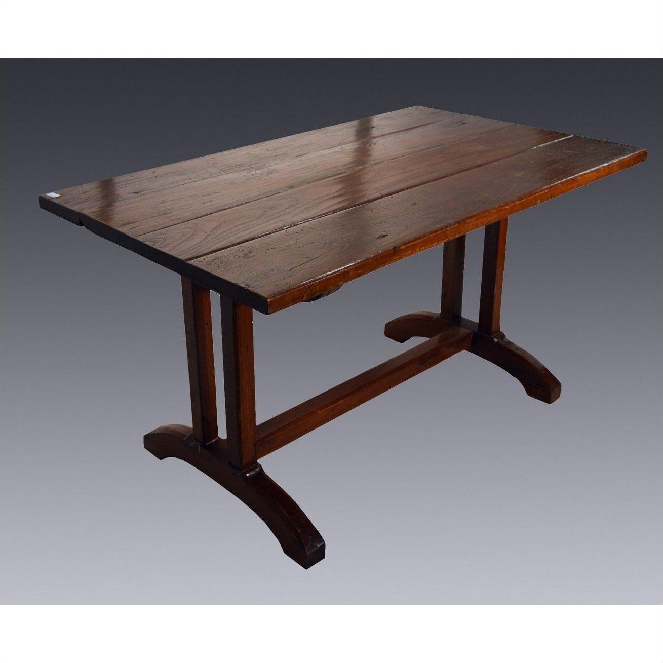 Wooden Indonesian dining table with plank top and double pedestal legs, displayed on a gray background.