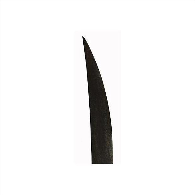 Close-up of a dark metal Indonesian sword with a curved hand-made blade and sharp point on white background.