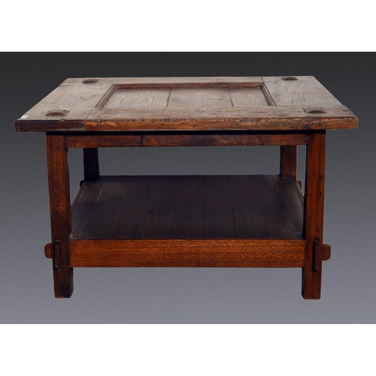 Brown wooden Indonesian antique table with rectangular top, lower shelf, and coffee design on gray background.
