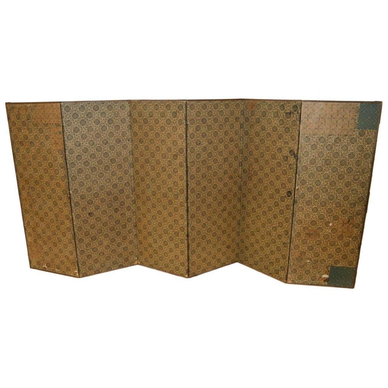 Gold gilt Japanese screen with geometric design, six panels, visible corner wear.