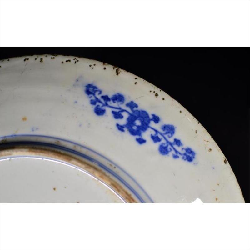 Close-up of a white porcelain plate with Japanese Igezara transferware detail.
