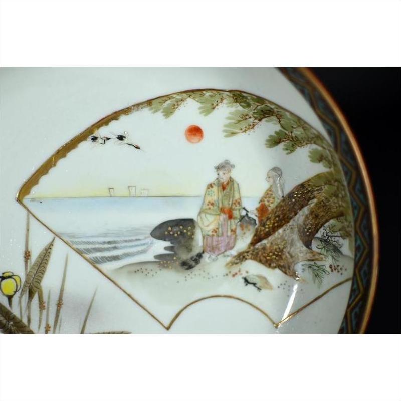 Antique Japanese Kutani porcelain plate with red sun, two figures in traditional attire by the sea.