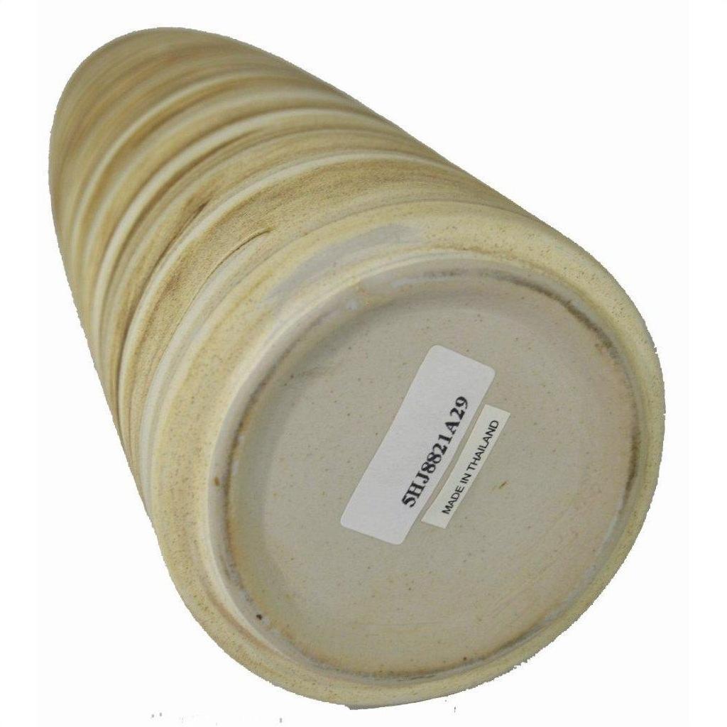Beige ceramic vase with earth tones lying on its side, visible MADE IN THAILAND barcode sticker underneath.