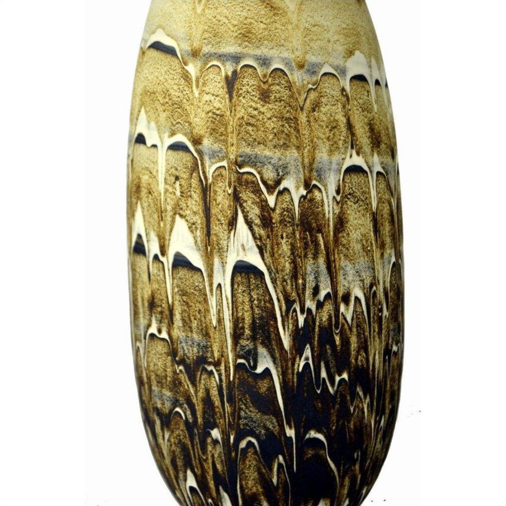 Close-up of glossy brown and cream ceramic vase with organic, feather-like pattern.