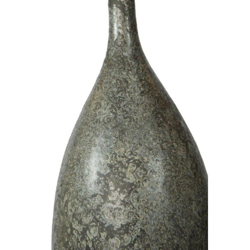 Close-up of gray ceramic vase with narrow neck and mottled, speckled finish.