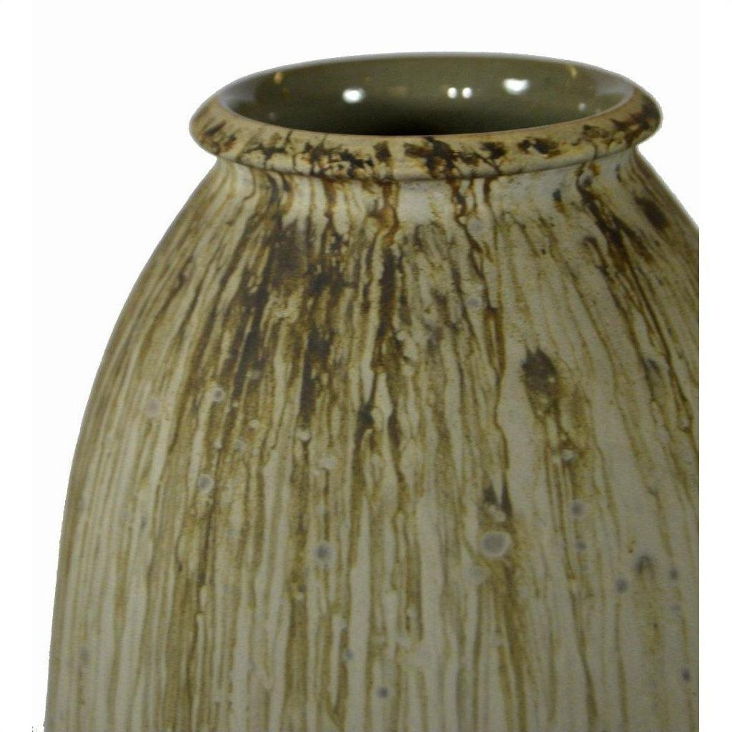 Close-up of beige and brown ceramic vase with streaked glaze and wide, round opening.
