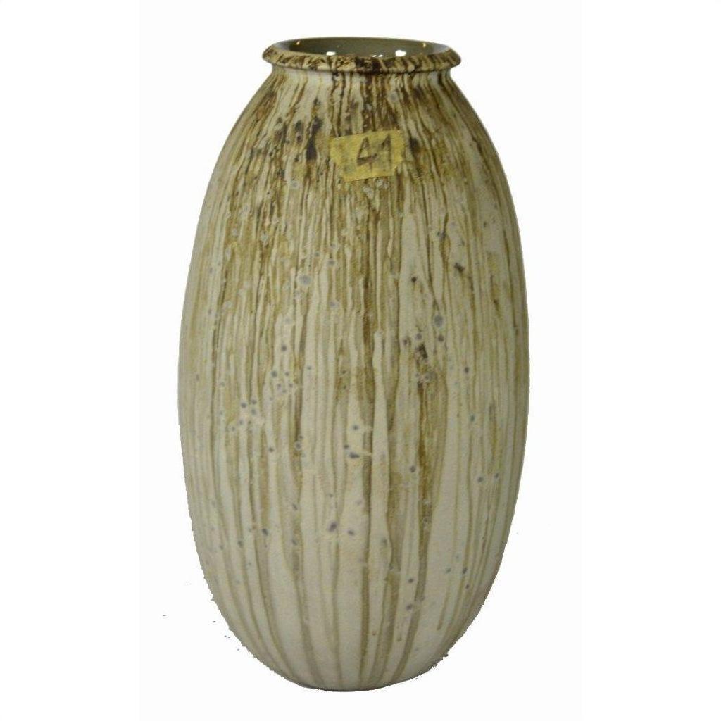 Close-up of tall beige unglazed ceramic vase with vertical brown streaks and a "41" label near the top.
