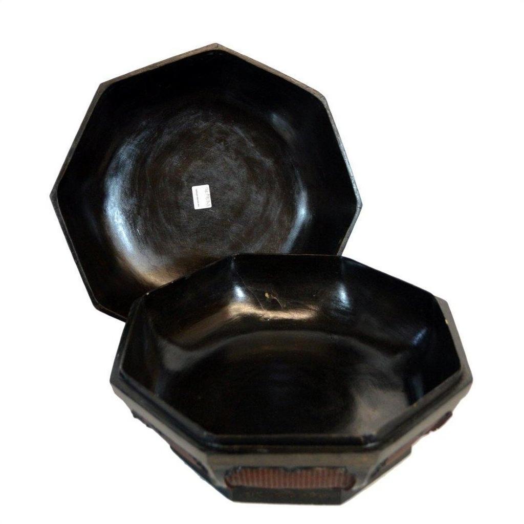 Glossy black hexagonal baskets with lids, one partially open, each showing a small white sticker inside.