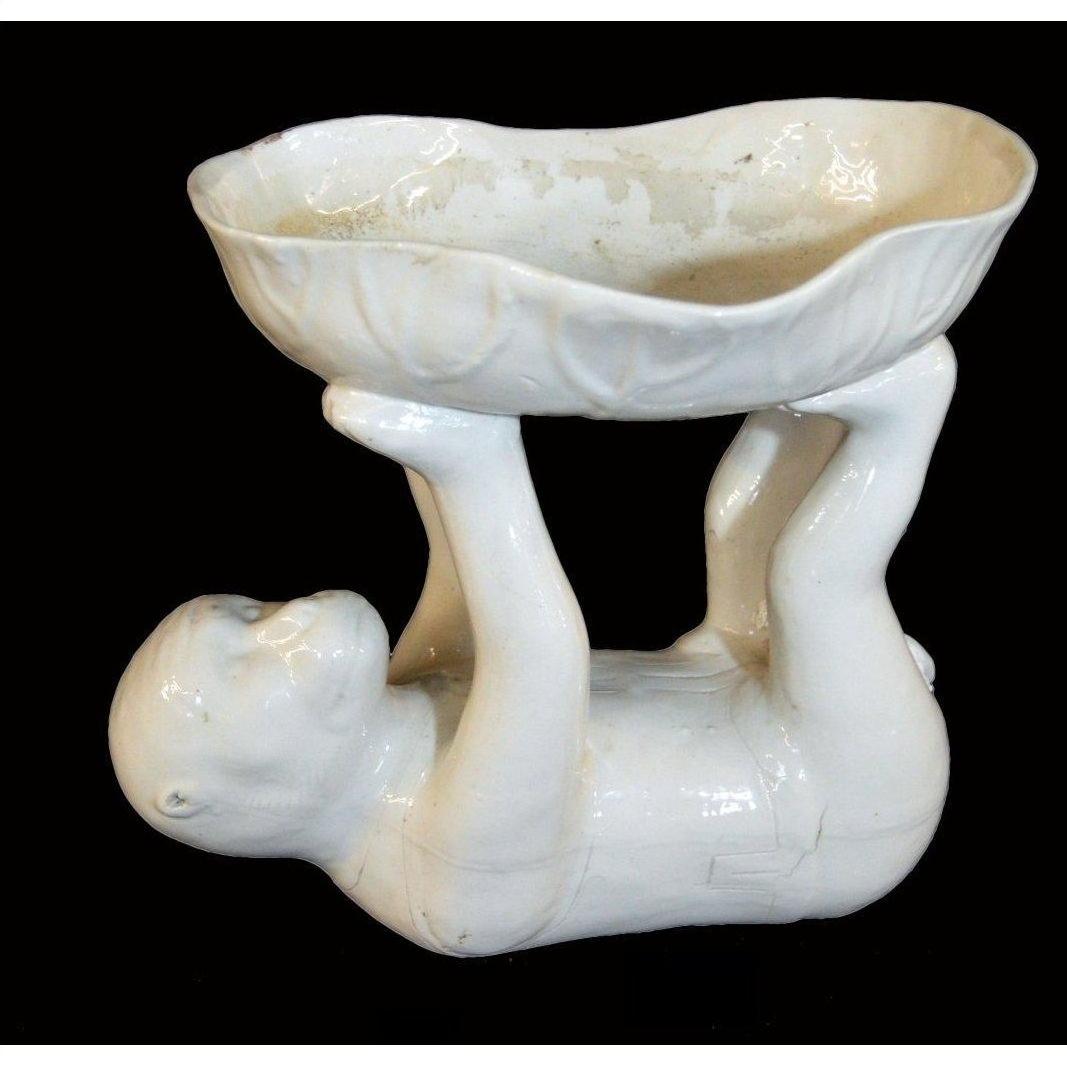 White porcelain monkey bowl, Blanc de Chine style, with monkey figure lifting the ceramic bowl using hands and feet.