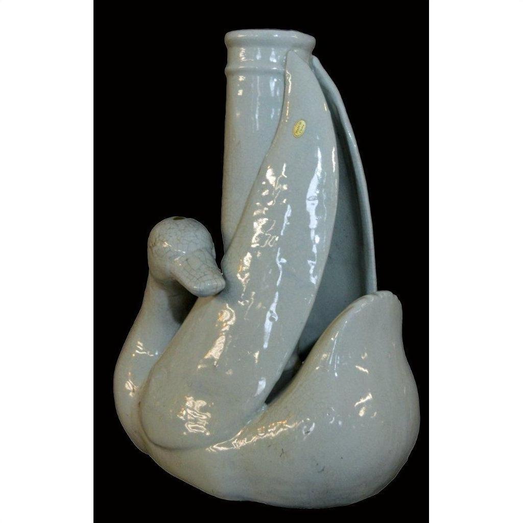 White porcelain swan vase with curved neck, Blanc de Chine style, close-up against a black background.