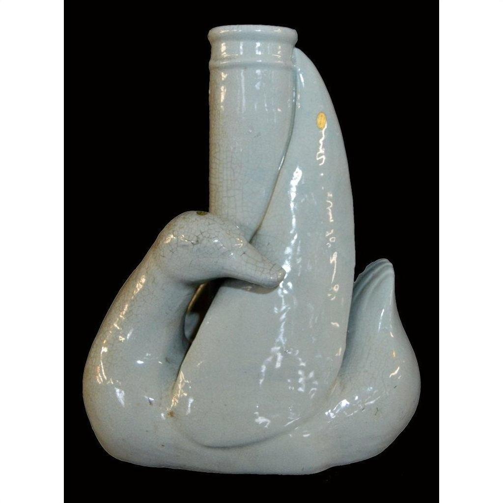 White porcelain swan vase with curved neck forming spout, Blanc de Chine style, close-up view.