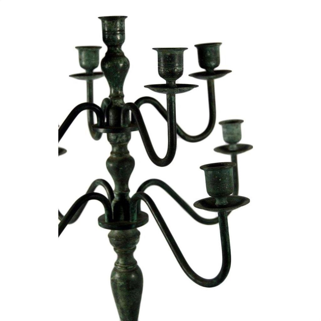 Bronze vintage candelabra with five candle holders and ornate curved arms, lost wax cast, on white background.