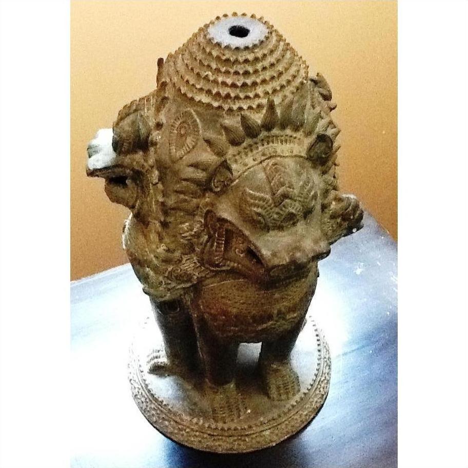 Bronze Guardian Lion lamp base with ornate carvings, multiple lions facing out, close-up from above.