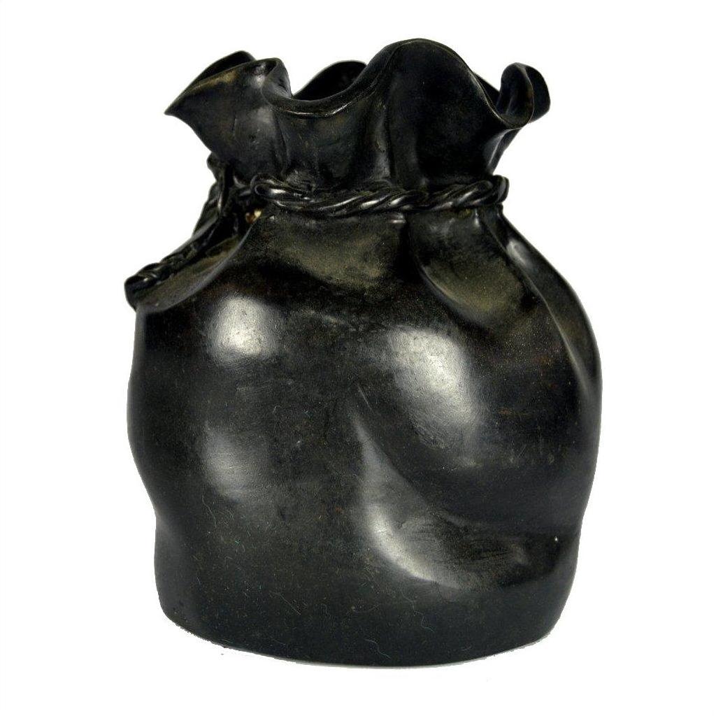 Bronze ceramic vase shaped like a tied sack with twisted rope design, close-up.