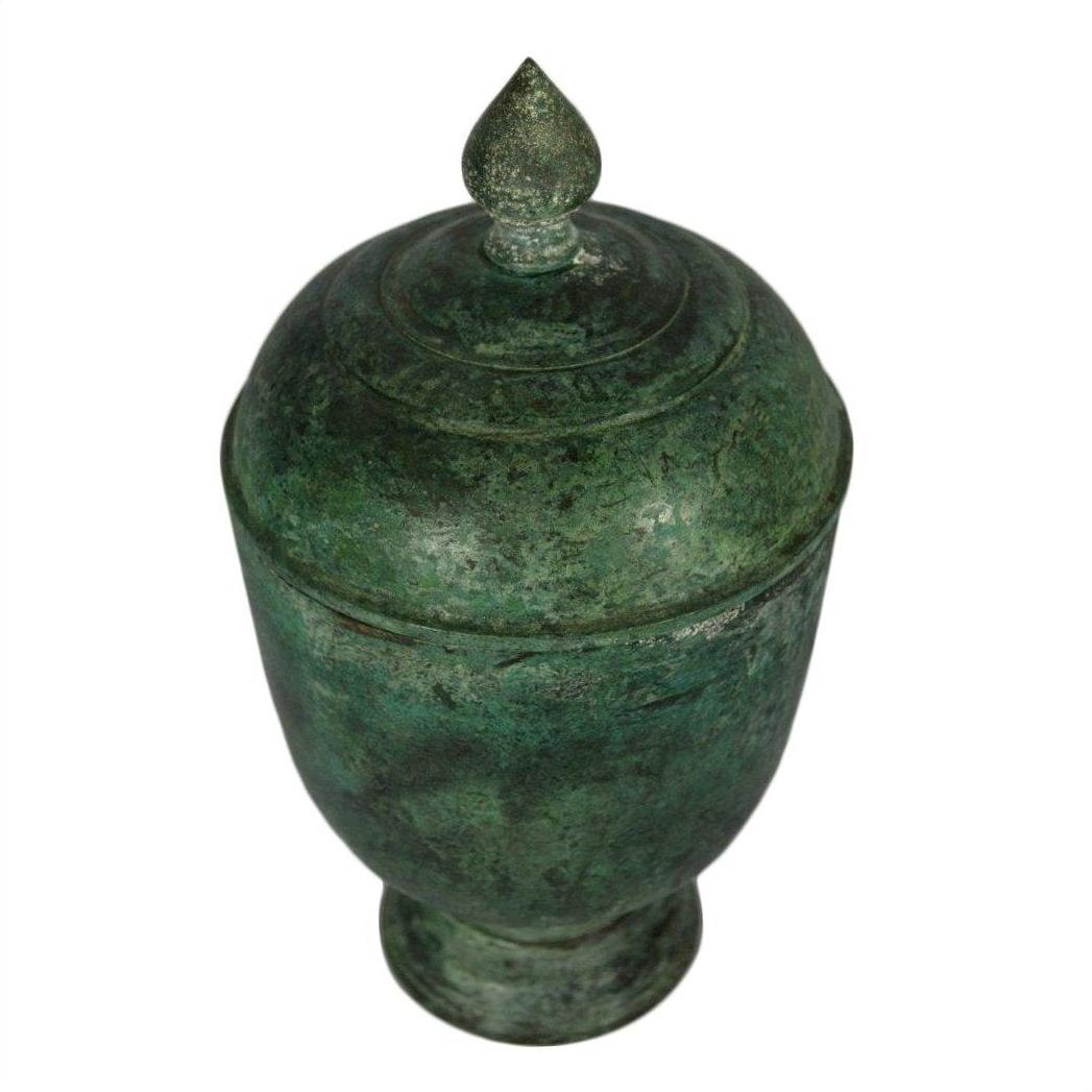 Bronze urn with lid, pointed finial, and subtle verde gris patina on white background.